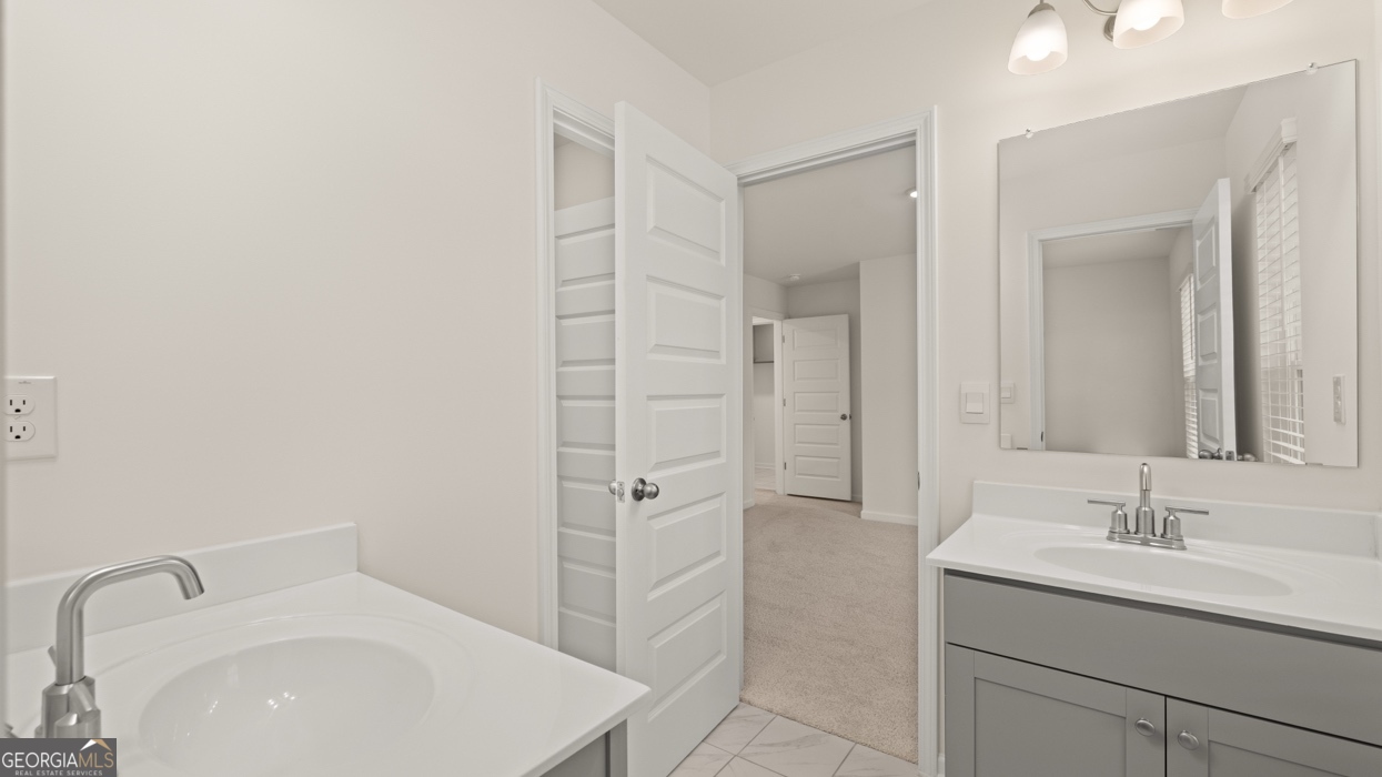 416 Hazel Drive Locust Grove, GA 30248 - Photo 26 of 31 a bathroom with a sink toilet and shower
