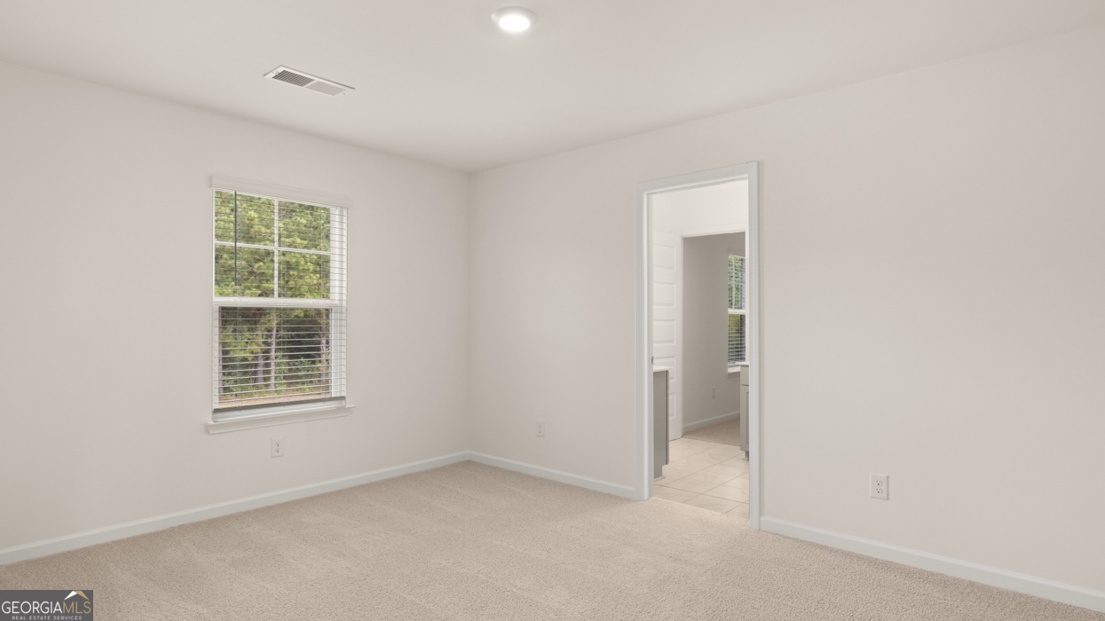 416 Hazel Drive Locust Grove, GA 30248 - Photo 27 of 31 an empty room with a window