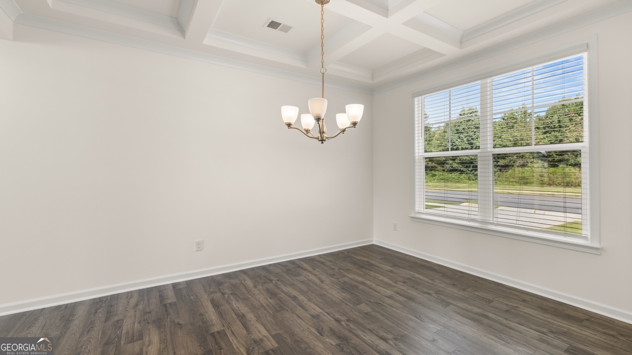 416 Hazel Drive Locust Grove, GA 30248 - Photo 4 of 31 a view of empty room with wooden floor and fan