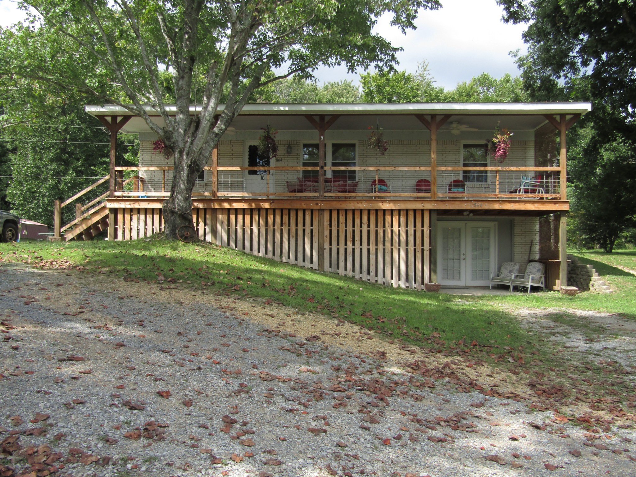 864 Hill Top Road Red Boiling Springs, TN 37150 - Photo 1 of 41 a view of a house with a yard and fence