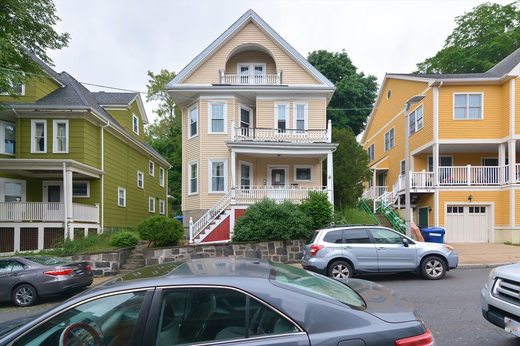 52 Tower Street Boston, MA 02130 - Photo 1 of 29 a front view of a residential apartment building with a yard