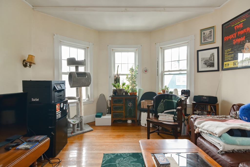 52 Tower Street Boston, MA 02130 - Photo 12 of 29 a livingroom with workspace and a window