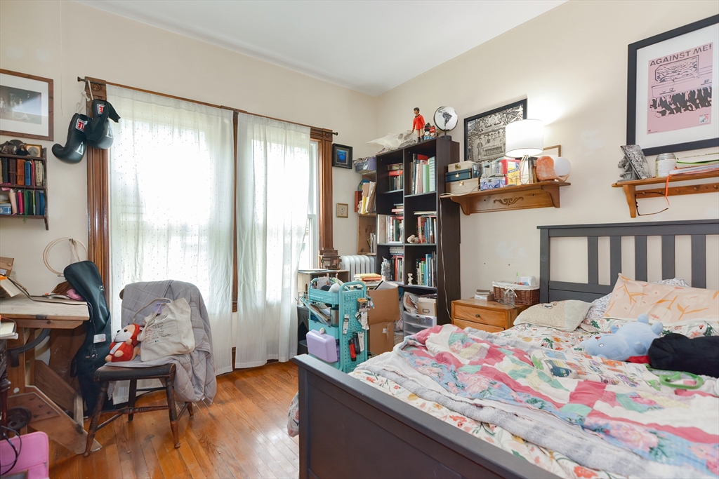 52 Tower Street Boston, MA 02130 - Photo 15 of 29 a bedroom that has a bed and a table in it