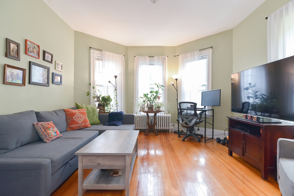 52 Tower Street Boston, MA 02130 - Photo 2 of 29 a living room with furniture and a flat screen tv