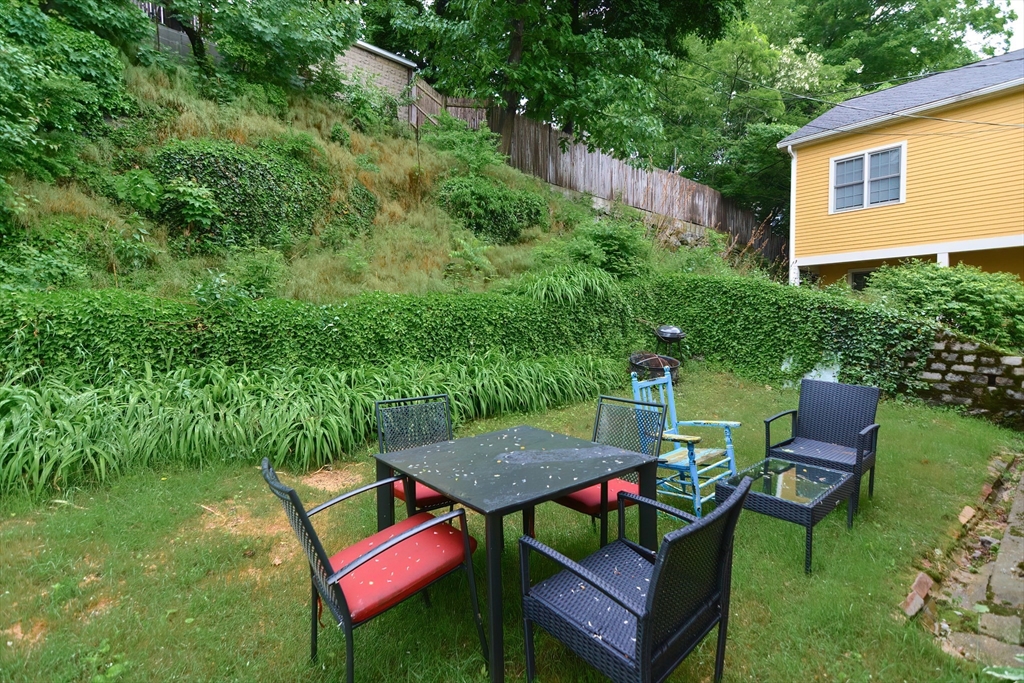 52 Tower Street Boston, MA 02130 - Photo 28 of 29 a view of a chairs and table in backyard