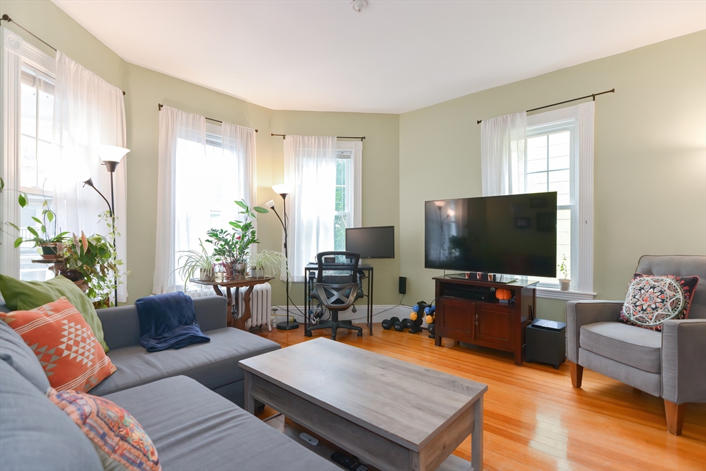 52 Tower Street Boston, MA 02130 - Photo 3 of 29 a living room with furniture and a flat screen tv