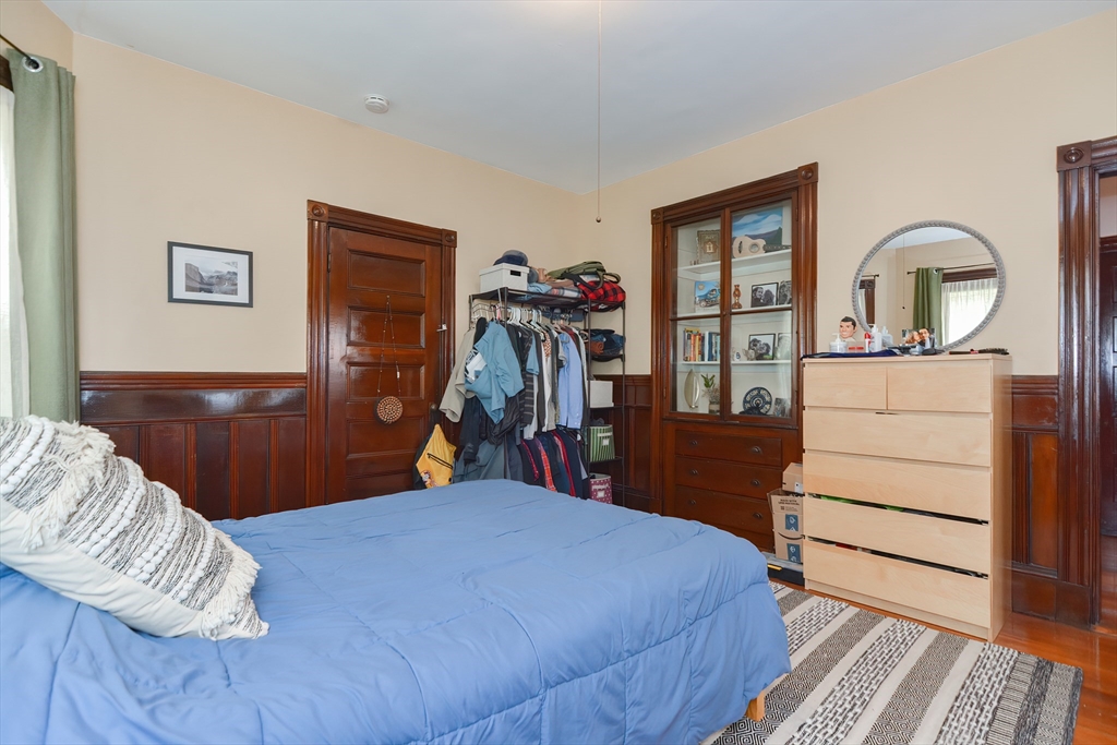 52 Tower Street Boston, MA 02130 - Photo 5 of 29 a bedroom with a bed and a dresser