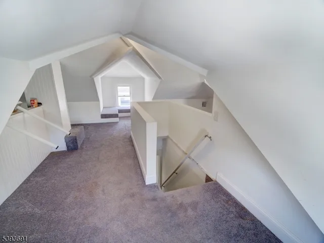 a view of a hallway view with staircase