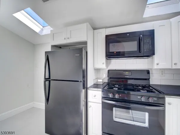 a kitchen with a stove and a microwave