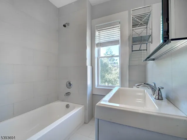 a bathroom with a sink and a bathtub