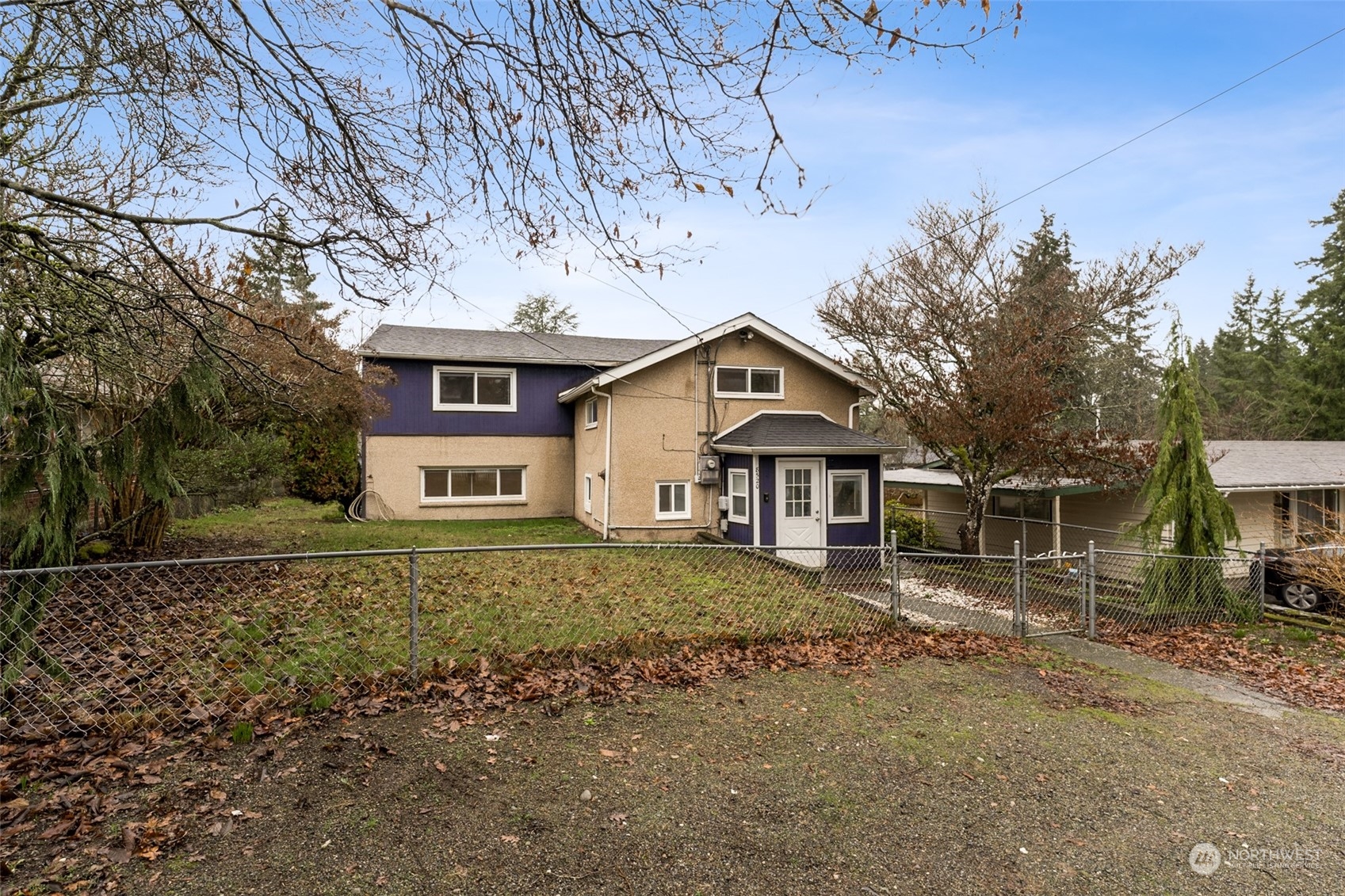 8520 Meadow Road Southwest Lakewood, WA 98499 - Photo 1 of 24 a front view of a house with a yard