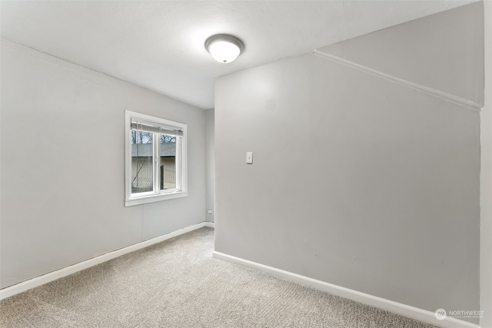 8520 Meadow Road Southwest Lakewood, WA 98499 - Photo 13 of 24 an empty room with windows