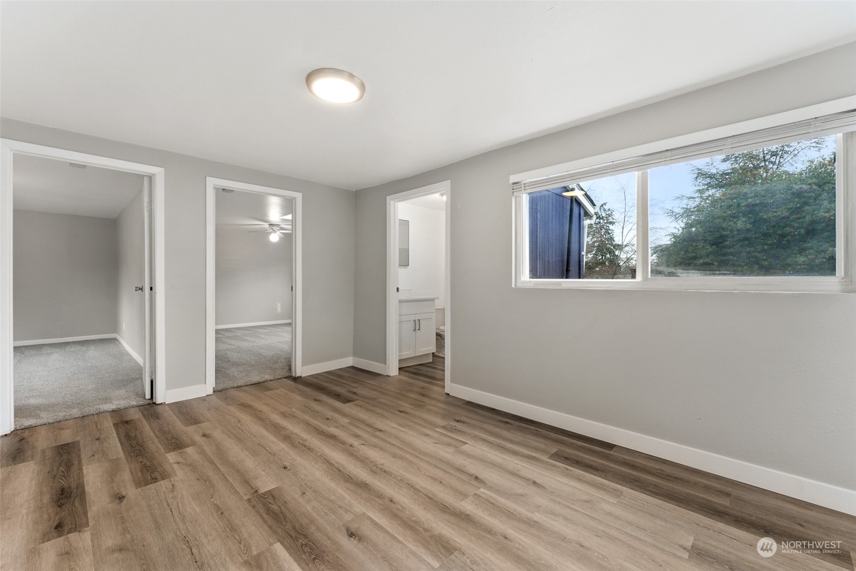 8520 Meadow Road Southwest Lakewood, WA 98499 - Photo 15 of 24 a view of empty room with wooden floor and fan