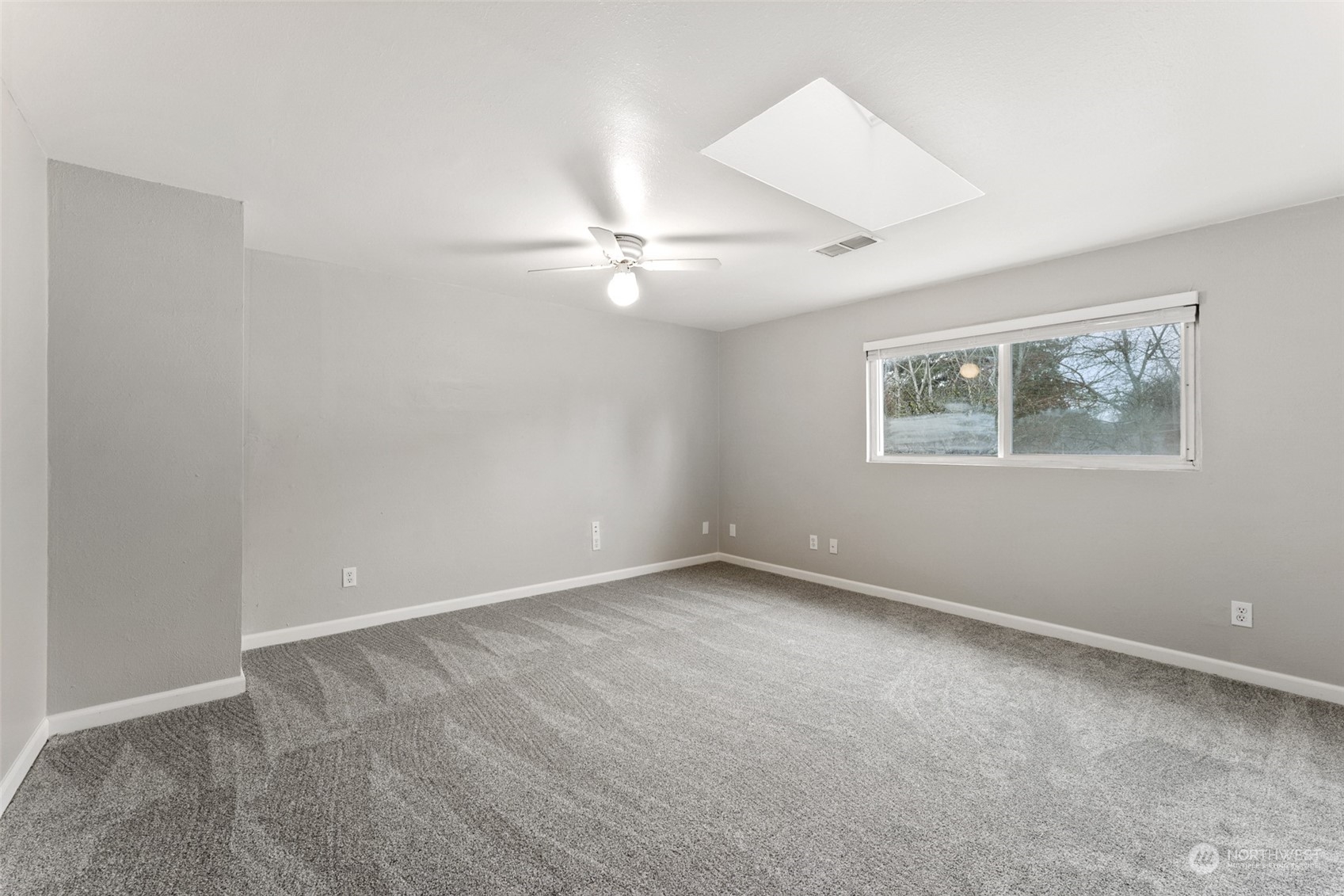 8520 Meadow Road Southwest Lakewood, WA 98499 - Photo 17 of 24 a view of an empty room with a window