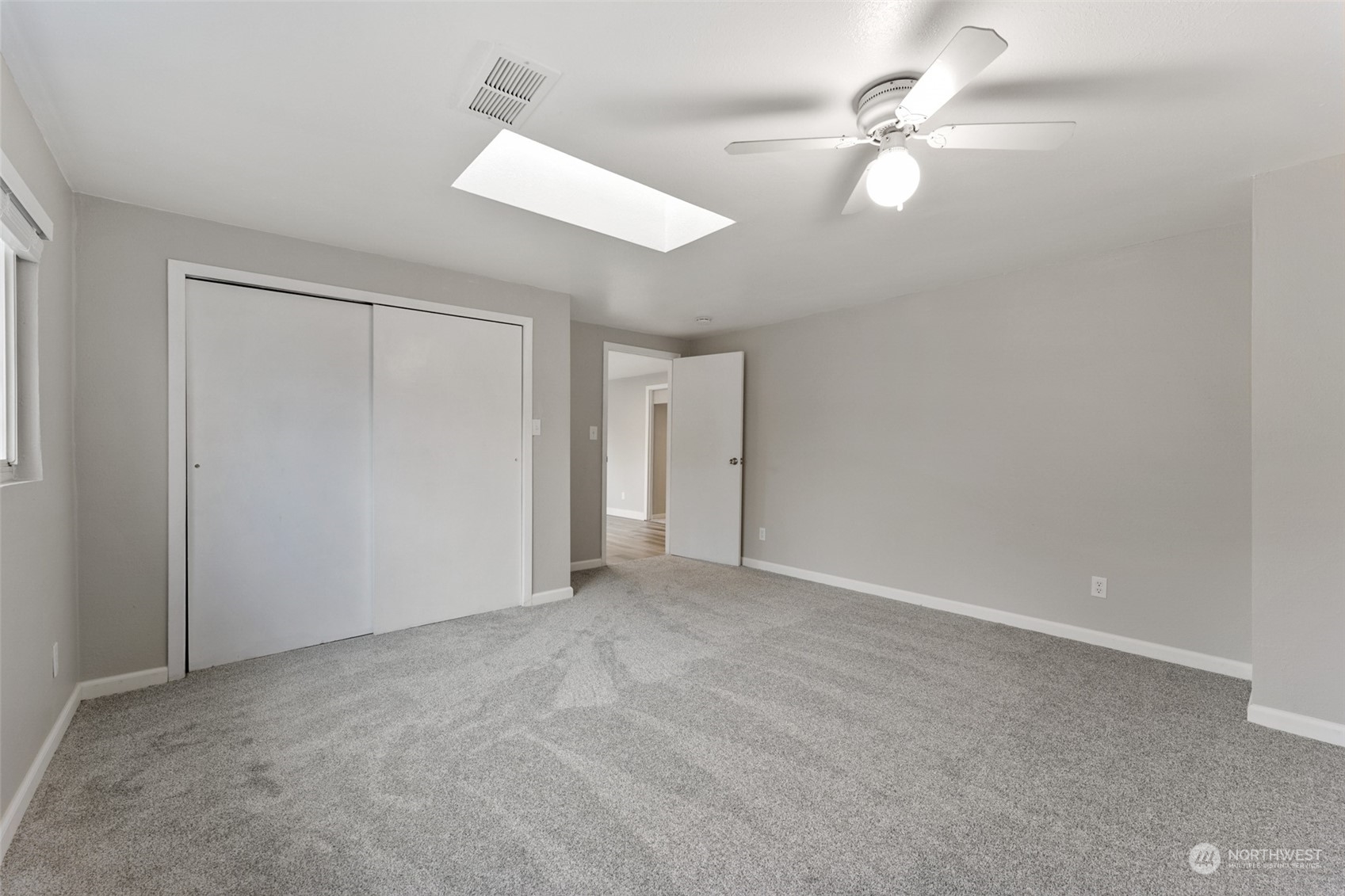 8520 Meadow Road Southwest Lakewood, WA 98499 - Photo 18 of 24 an empty room with a ceiling fan and a fan
