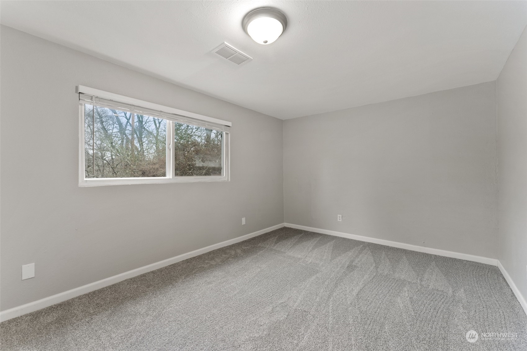 8520 Meadow Road Southwest Lakewood, WA 98499 - Photo 19 of 24 an empty room with windows