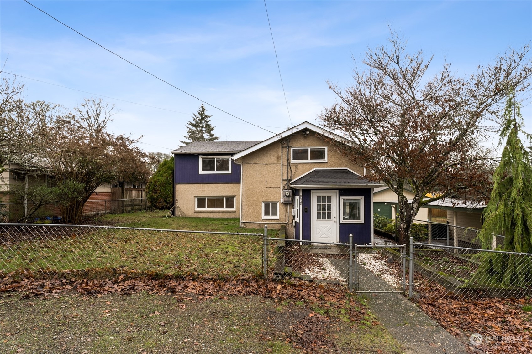 8520 Meadow Road Southwest Lakewood, WA 98499 - Photo 2 of 24 a front view of a house with a yard