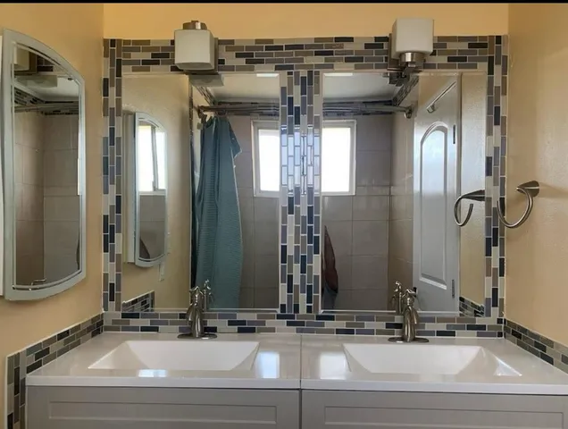 a bathroom with a sink and a mirror