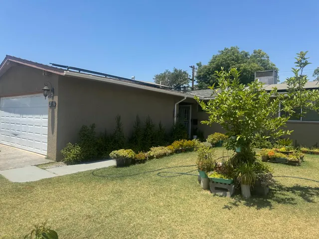 a backyard of a house with lots of green space
