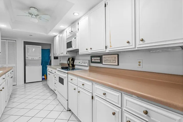 a view of a livingroom with furniture and a window