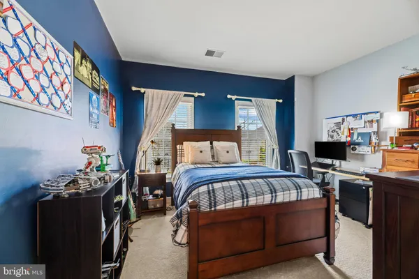 a bedroom with a bed furniture and a window