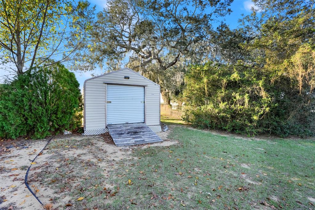 13330 Georgia Avenue Astatula, FL 34705 - Photo 12 of 16 a front view of a house with a yard