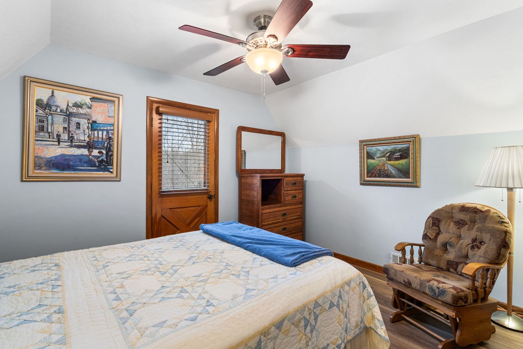 1721 Settlement Road Young Harris, GA 30582 - Photo 19 of 54 a bedroom with a bed dresser and a window