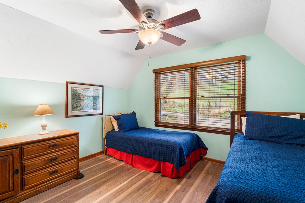 1721 Settlement Road Young Harris, GA 30582 - Photo 21 of 54 a bedroom with a bed and a large window