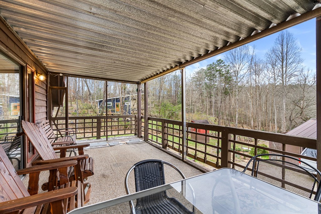1721 Settlement Road Young Harris, GA 30582 - Photo 33 of 54 a view of balcony with a large window and furniture