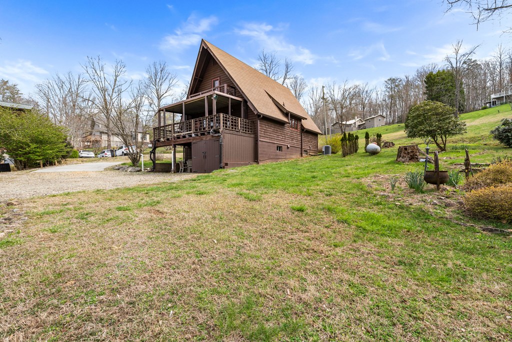 1721 Settlement Road Young Harris, GA 30582 - Photo 37 of 54 a view of a big house with a big yard and large trees