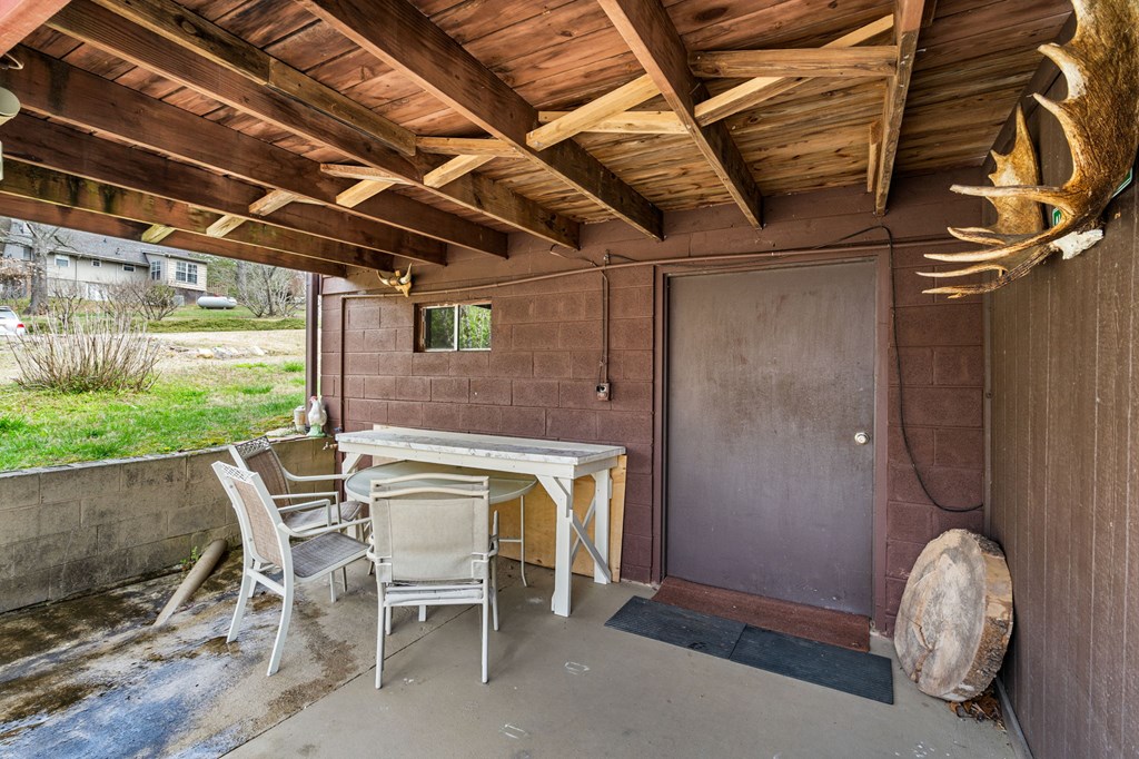 1721 Settlement Road Young Harris, GA 30582 - Photo 47 of 54 a view of a patio with table and chairs