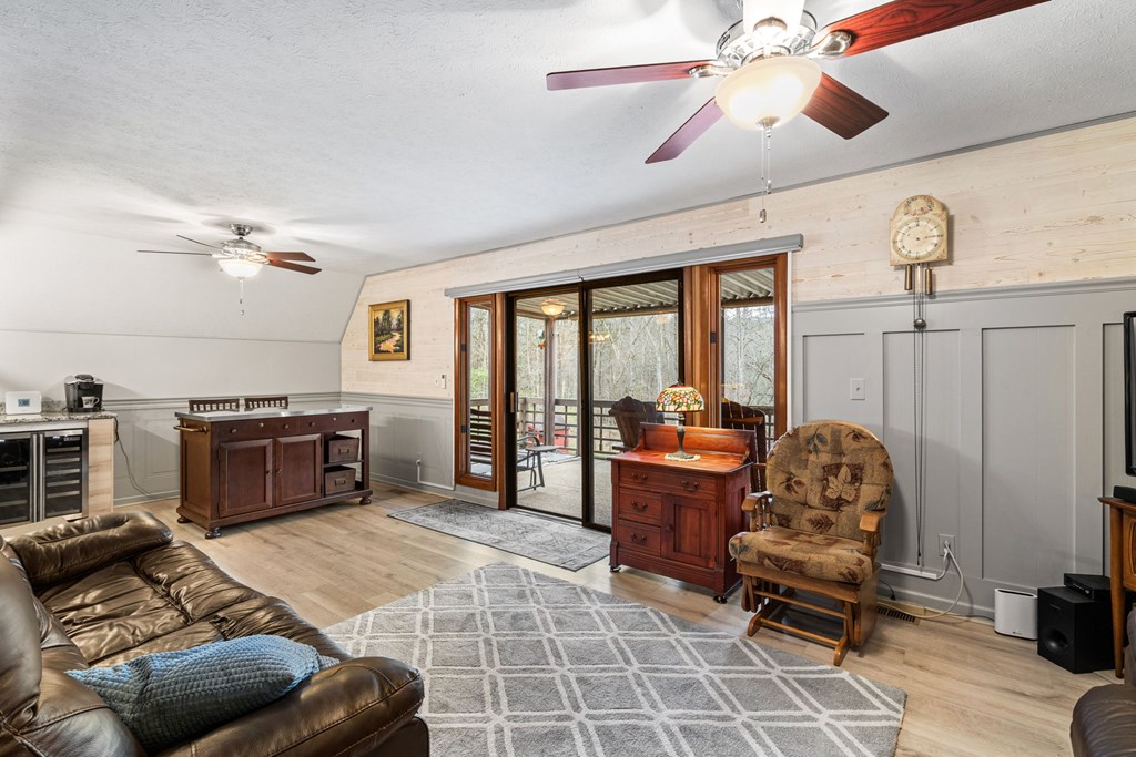 1721 Settlement Road Young Harris, GA 30582 - Photo 6 of 54 a living room with furniture and a flat screen tv