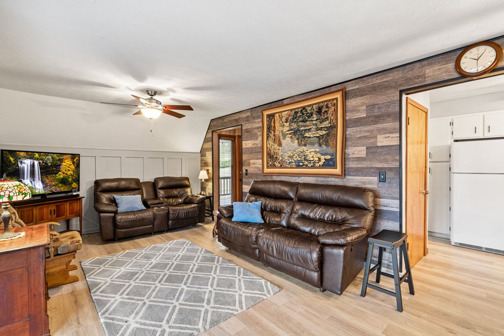 1721 Settlement Road Young Harris, GA 30582 - Photo 7 of 54 a living room with furniture and a fireplace