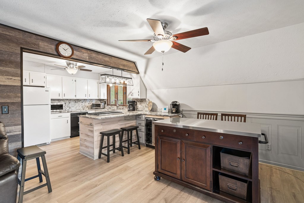 1721 Settlement Road Young Harris, GA 30582 - Photo 8 of 54 a kitchen with a sink cabinets and wooden floor
