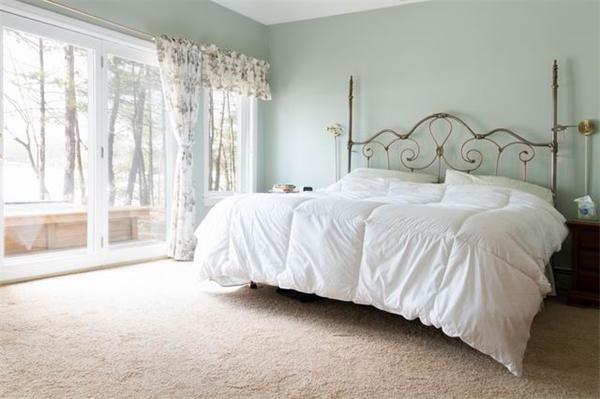 69 Kingland Road Stow, MA 01775 - Photo 16 of 30 a bedroom with a bed and a large window