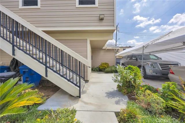 a large kitchen with stainless steel appliances granite countertop a lot of counter space and a sink
