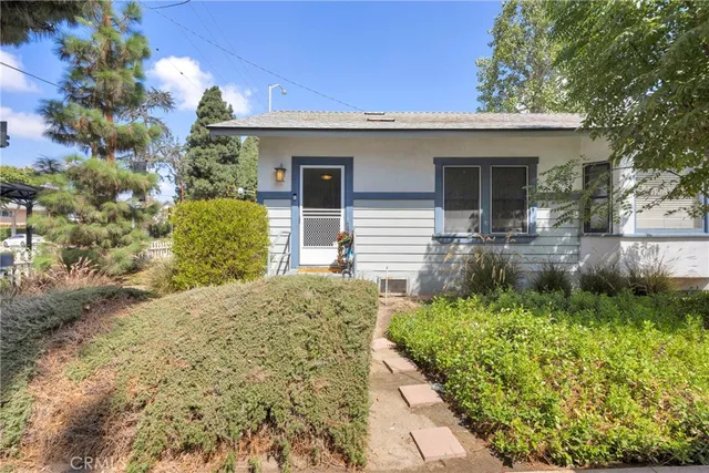 a kitchen with stainless steel appliances granite countertop sink stove top oven and cabinets