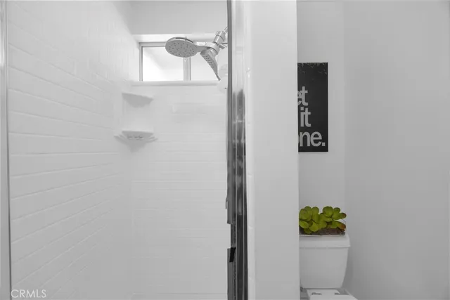 a living room with furniture flat screen tv and a fireplace