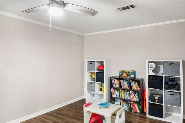 a room with furniture and a book shelf