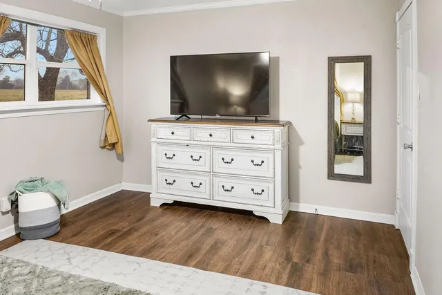 a living room with furniture and flat screen tv