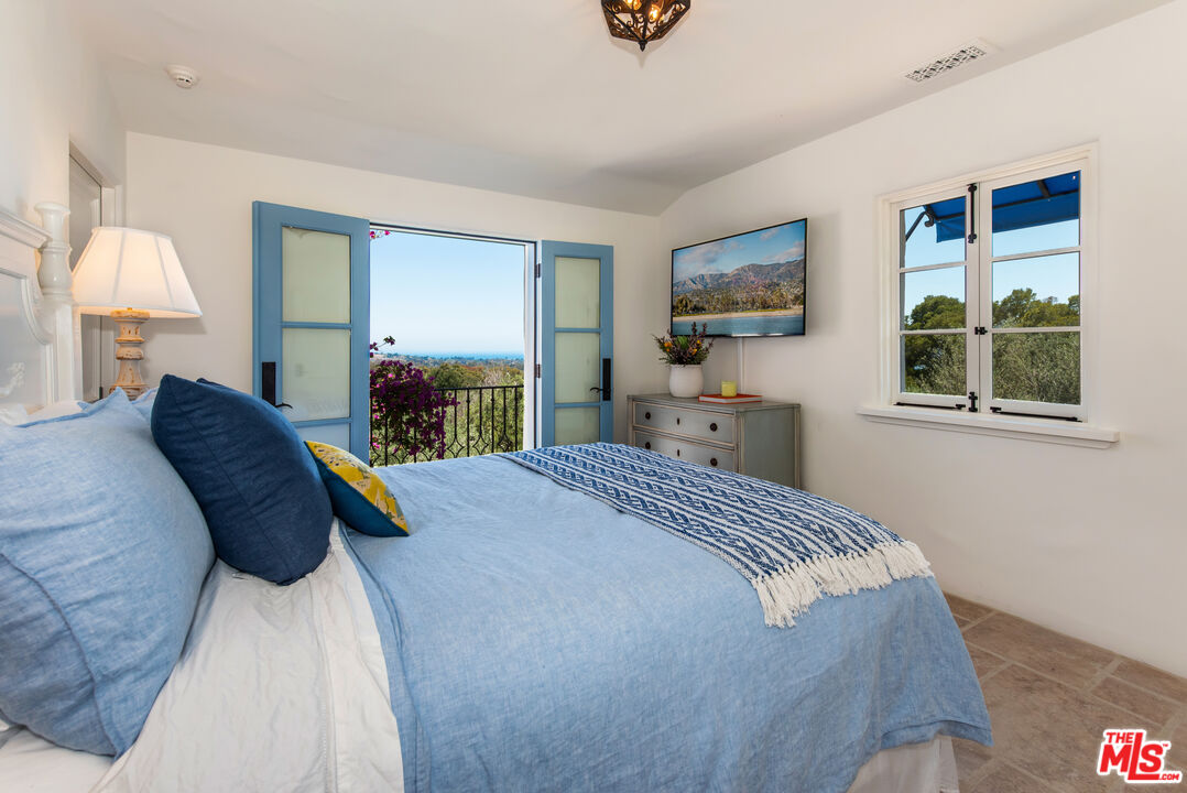 848 Picacho Lane Montecito, CA 93108 - Photo 16 of 22 a bedroom with a bed and a window
