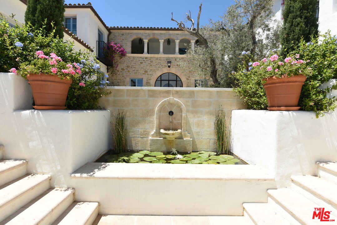 848 Picacho Lane Montecito, CA 93108 - Photo 4 of 22 a view of small house with potted plants