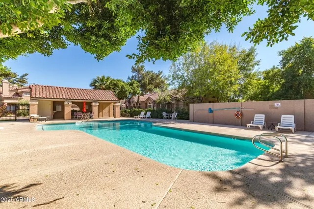 a front view of house with yard and outdoor seating