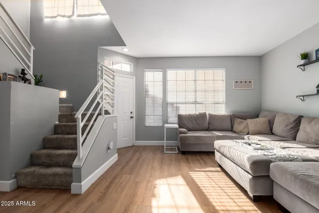 a living room with furniture and a large window