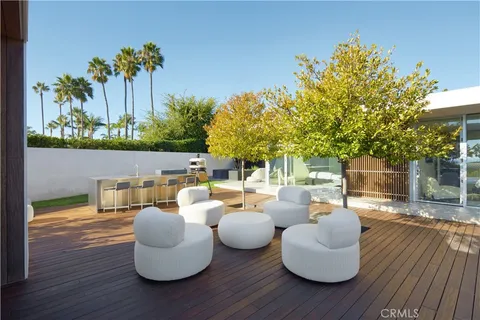 swimming pool view with a seating space
