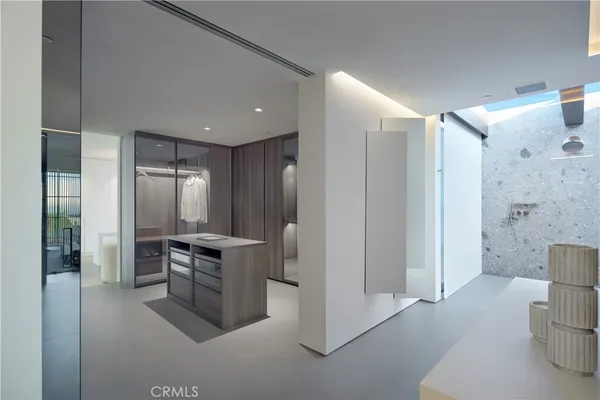 a kitchen with stainless steel appliances granite countertop a refrigerator and a stove