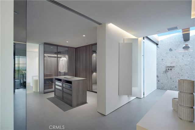 a kitchen with stainless steel appliances granite countertop a refrigerator and a stove