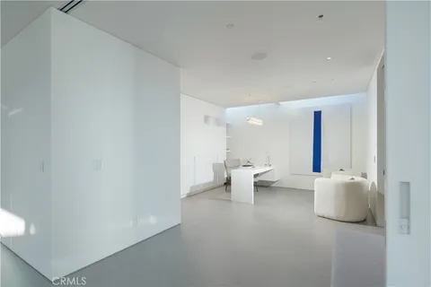 a view of living room filled with furniture and window