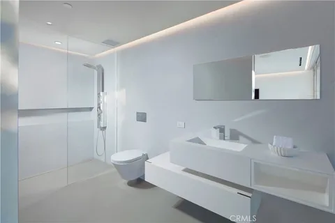 a bathroom with a toilet sink and shower