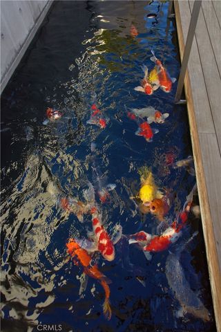 a view of a patio with table and chairs and potted plants
